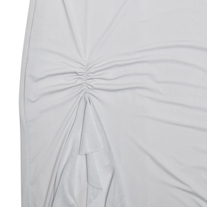 Detailed close-up of side drawstring ruching and high slit on a light gray dress