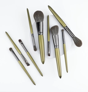 Detail view of 8-piece makeup brush set with metallic green handles and dark bristles