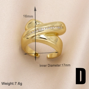 Macro detail of gold-plated heart ring with cubic zirconia on silk, showing 17mm diameter