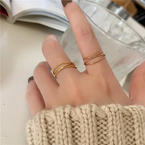 French minimalist layered intertwined rings in 18K gold plating for an elegant modern style