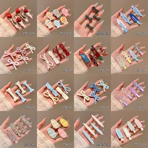Detailed multi-grid view of various hair clip styles including hearts and bows with dimensions