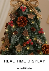 Detail of mini Christmas tree with pine cones, red berries, and warm LED lights
