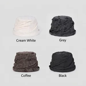 Distressed knit bucket hat in off-white, gray, coffee, and black with ripped texture