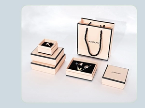 Champagne jewelry gift boxes and matching bags set with minimalist black trim and logo