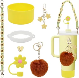 Macro detail of sunflower theme accessory kit for tumblers featuring yellow silicone boot