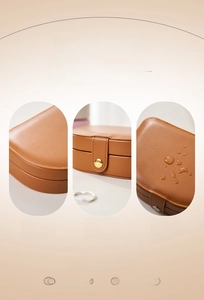 Detail of waterproof brown PU leather jewelry box with durable metallic snap closure