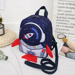 Close-up of kids rocket backpack with 3D astronaut helmet pocket and wings in deep blue