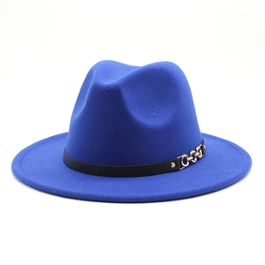 Close-up of royal blue wool fedora hat featuring a black band and gold chain buckle detail