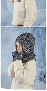 Detailed view of kids winter knit set featuring thick pompom hat and cozy neck warmer