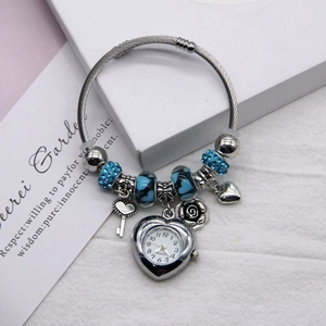 Silver twisted chain bracelet watch with blue flower beads and a heart quartz charm