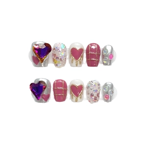 Y2K style handmade press-on nail set with chrome silver finish and pink heart rhinestones