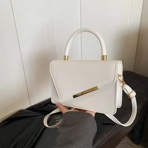 Minimalist white lychee pattern crossbody bag with golden hardware and top handle