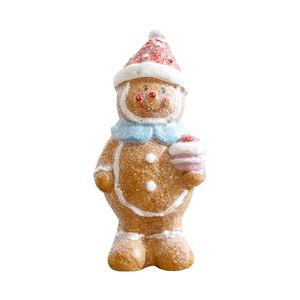 Festive resin gingerbread man ornament with Santa hat and scarf on a white background
