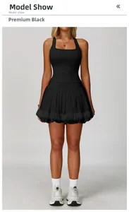 Front view of black yoga tennis dress with tight vest top and layered mesh skirt