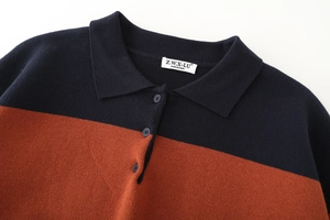 Close-up of polo collar and striped knit texture in navy blue and orange red colors
