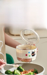 Detail of three-compartment spice box showing one-handed operation and cute cat print