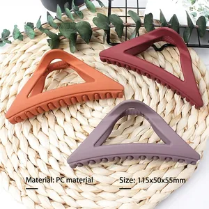 Three-piece large triangle matte hair clips in orange, dark red, and grey purple colors