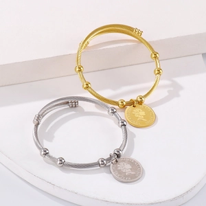 Titanium steel braided cuff bracelet with Elizabeth II coin charms in gold and silver