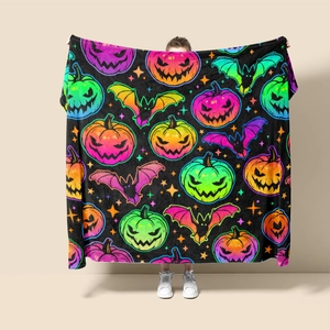 Full view of thick flannel blanket with neon Halloween pumpkin and bat prints
