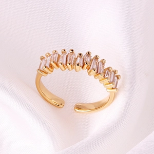 Adjustable 18K gold-plated open ring with nine rectangular zircon stones on white silk