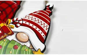 Detail of Christmas wooden gnome sign with high-definition UV printing and rustic jute rope