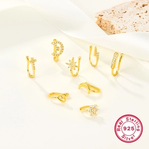 Detailed set of 8 gold-plated 925 sterling silver ear cuffs with cubic zirconia stars