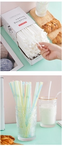 Detail of disposable drinking straws with individual paper wrap and colorful stripes