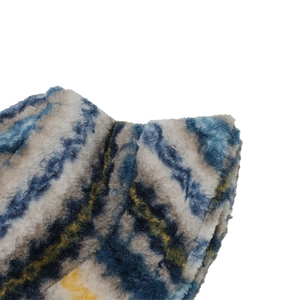 Close-up of fuzzy plush bucket hat showing blue and yellow gradient marble texture