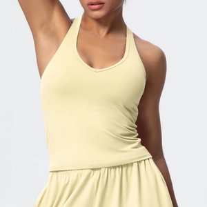 Close-up of light yellow V-neck sports bra and matching high-stretch yoga shorts