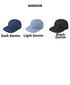 Detailed view of flat brim denim caps in dark blue, light blue, and black washes