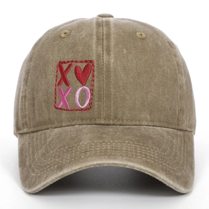 Vintage washed cotton baseball cap featuring embroidered XOXO heart design in tan color