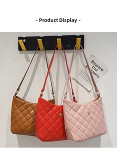 Detailed close-up showing brown red and pink quilted mini bucket bags with gold flower logos