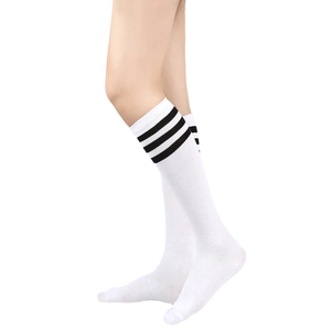 Detail of white knee-high socks with three black stripes in soft elastic knit
