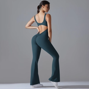 Dark teal backless yoga jumpsuit with flared pants and peach lift design for fitness