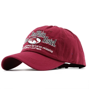Distressed cotton baseball cap in burgundy with Dolphin Hotel 3D embroidery detail