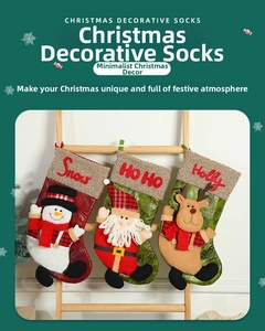 Detail of Christmas stockings with 3D Santa, Snowman and Reindeer hanging on a ladder