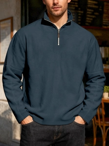 Navy blue fleece quarter-zip sweatshirt with stand collar for men in outdoor setting