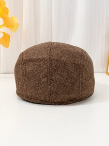 Detailed back view of dark brown linen flat cap showing breathable woven texture