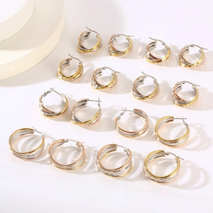 Three-tone titanium steel interlocking hoop earrings set in gold, silver, and rose gold