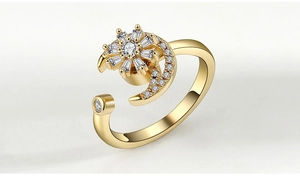 Detail of adjustable gold ring featuring sparkling moon and star zircon flower design