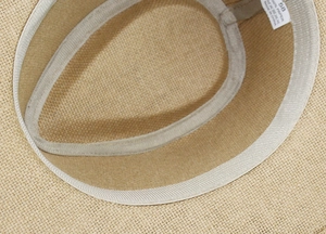 Close-up of the breathable paper straw interior with a comfortable sweatband, size 58