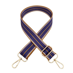 Detail of woven blue and brown ethnic strap with gold metal hooks and adjustable buckle