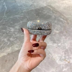 Detailed view of luxury silver rhinestone encrusted foldable makeup mirror surface