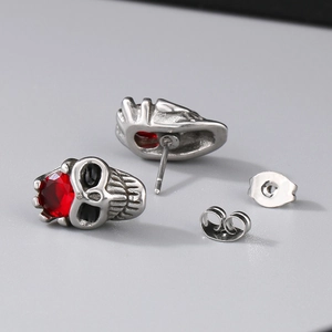 Gothic punk skull stud earrings in antique silver with red crystals for Halloween