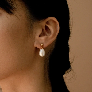 Elegant gold plated stainless steel stud earrings with white baroque freshwater pearls