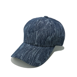 Close-up of dark blue denim baseball cap with unique vertical stripe texture and stitching