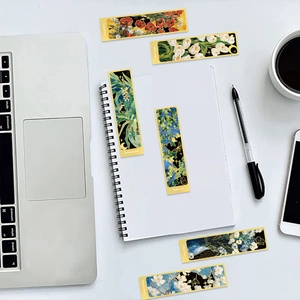 Flat lay of vintage floral bookmarks with gold foil details and artistic plant illustrations
