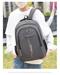 Detail of grey laptop backpack with orange sport letter print and side mesh pocket