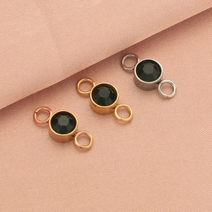 Three stainless steel connectors in silver gold and rose gold with black faceted stones