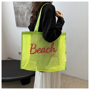 Fashionable neon green mesh beach tote bag featuring bold red Beach Vibes lettering